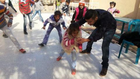 Children play capoeira in Raqqa with one of the trainers, in 2013. Source: Bidna Capoeira on flickr