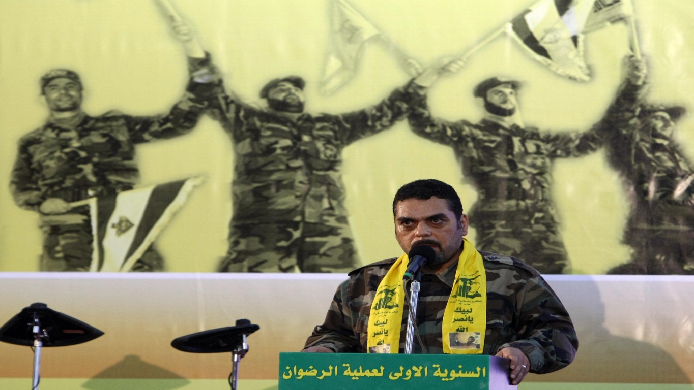 Lebanese Samir Kantar, a prisoner freed by Israel during a prisoner swap, speaks during a celebration marking the first anniversary of the swap between Hezbollah and Israel, in Beirut on July 17, 2009. The July 16, 2008 prisoner swap included the return of 199 bodies, along with the release of the remaining five Lebanese prisoners in Israel. In exchange, Hezbollah handed over the bodies of two Israeli soldiers captured in a cross-border raid on July 12, 2006, sparking a devastating 34-day war. AFP PHOTO/ RAMZI HAIDAR (Photo credit should read RAMZI HAIDAR/AFP/Getty Images)