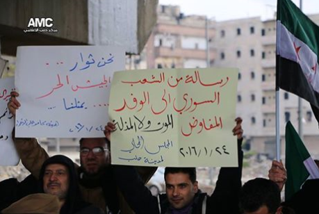 لافتة تندد بمؤتمر جنيف3، المصدر: شبكة الثورة السورية، فيس بوك.