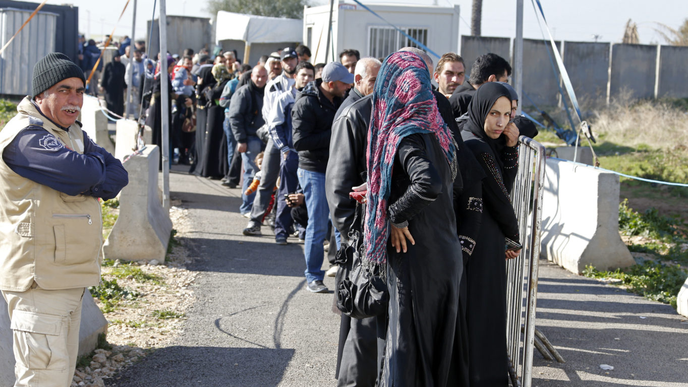 [Photo: Line of refugees in front of the UNHCR registration center in Tripoli - Lebanon - 8-1-2014 (Mohamed Azakir/World Bank/via CC BY-NC-ND 2.0)].