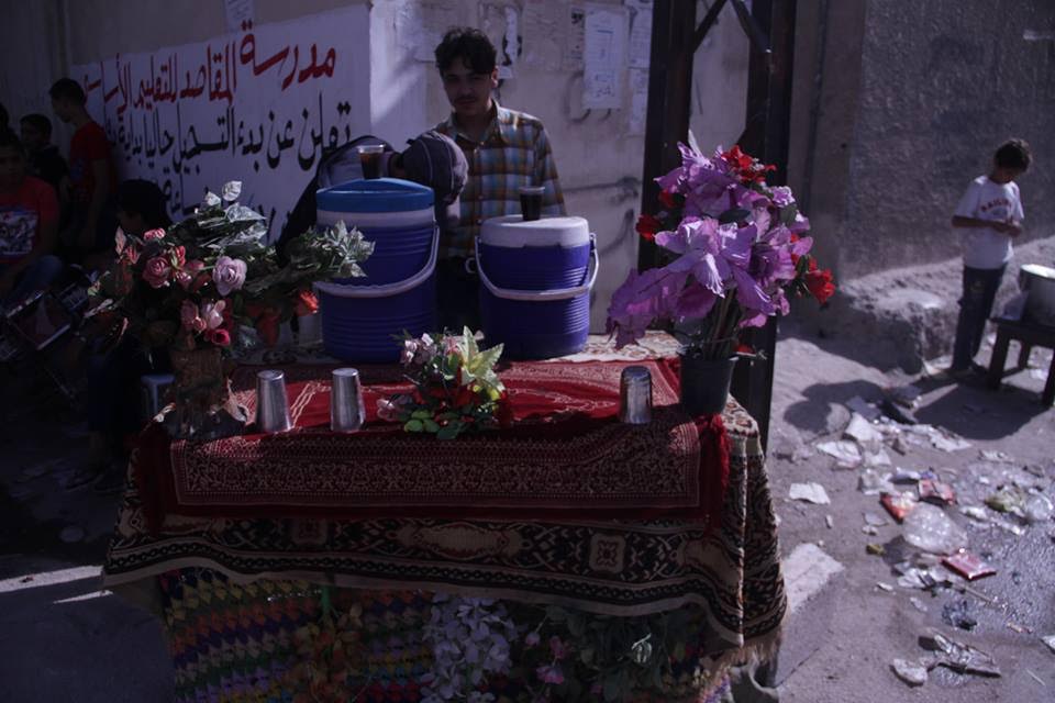 [Photo: Tamarind Juice Seller in al-Qabun - Damascus - ʻAid al-Adha (Sept 12-14) 2016 (Rafia Salamah/SyriaUntold)].