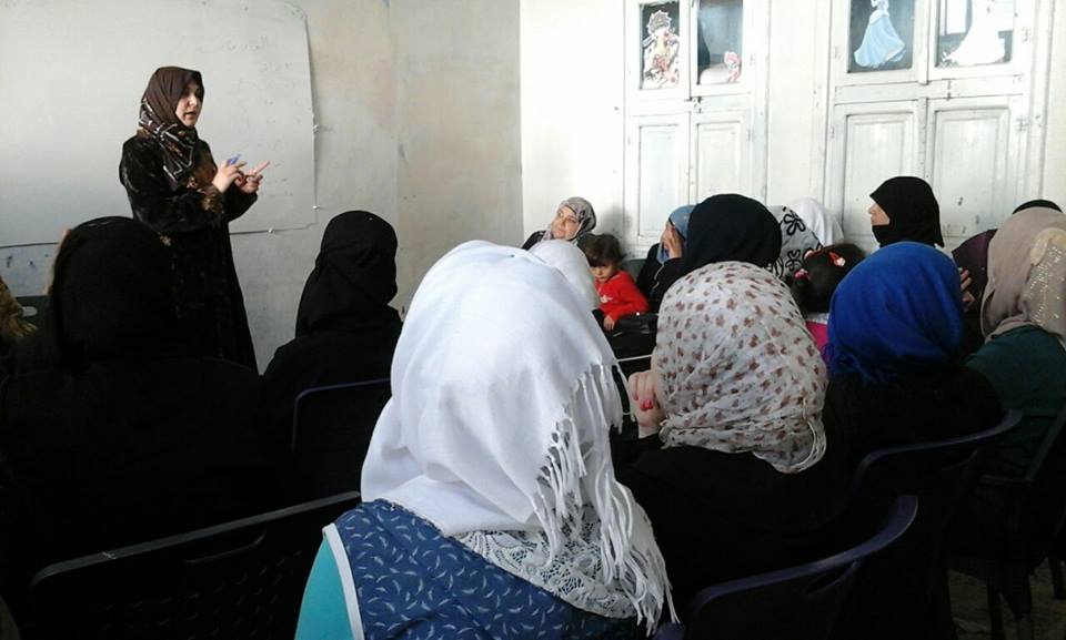 [Photo: Women take part in one of the seminars organized by the Mazaya Center - Kafranbel - Idlib - 24-10-2016 (Mazaya Center Facebook page)].